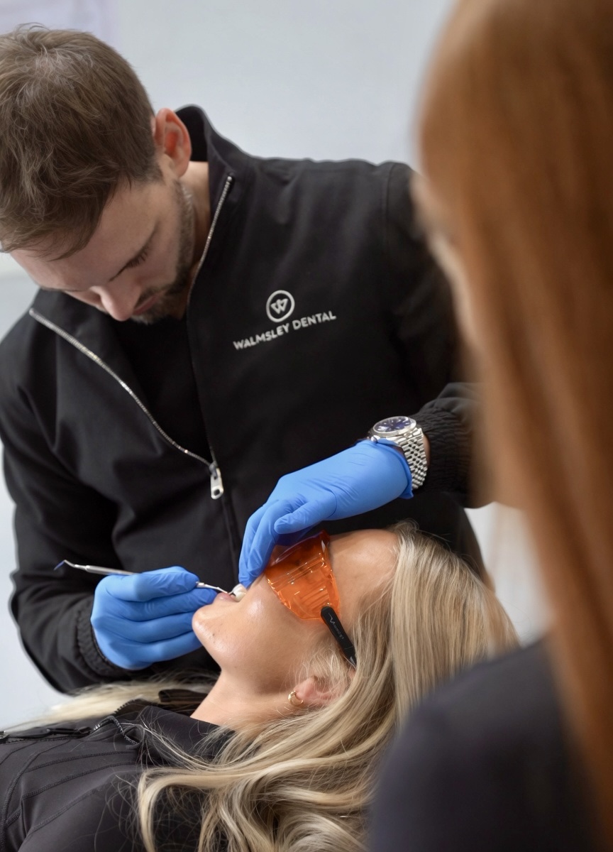 Dr Edward Walmsley sculpting a composite smile preview chair-side at Walmsley Dental, Droylsden